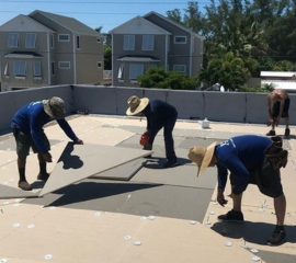 Inspecting Flat Roof for Maintenance