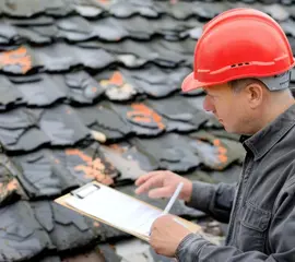 Working inspecting a Roof