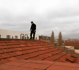 Worker standing on a Roof for wokr