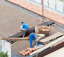 Worker Installing Clay Tiles